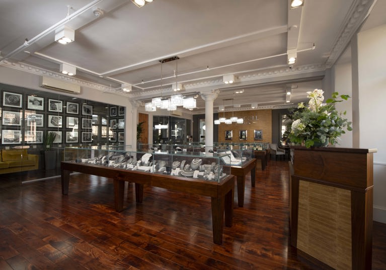 Tom Coll Jewellery showroom in Argyll Arcade, Glasgow, displaying an impressive selection of engagement rings, wedding bands, pre-owned Rolex watches, with an in-house workshop.